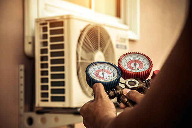 Professional Air Conditioning Service technician working in Worth, IL